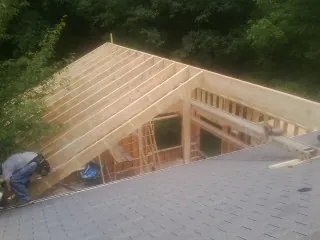 Framing a new roof addition that ties into an existing shingle roof in Dobbs Ferry